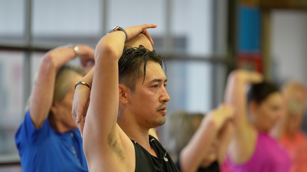 Stretching overhead during a Kinetics 360 class